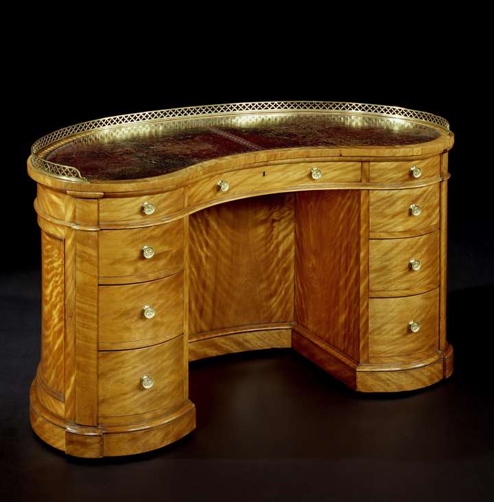 A VICTORIAN SATINBIRCH KIDNEY SHAPED DESK